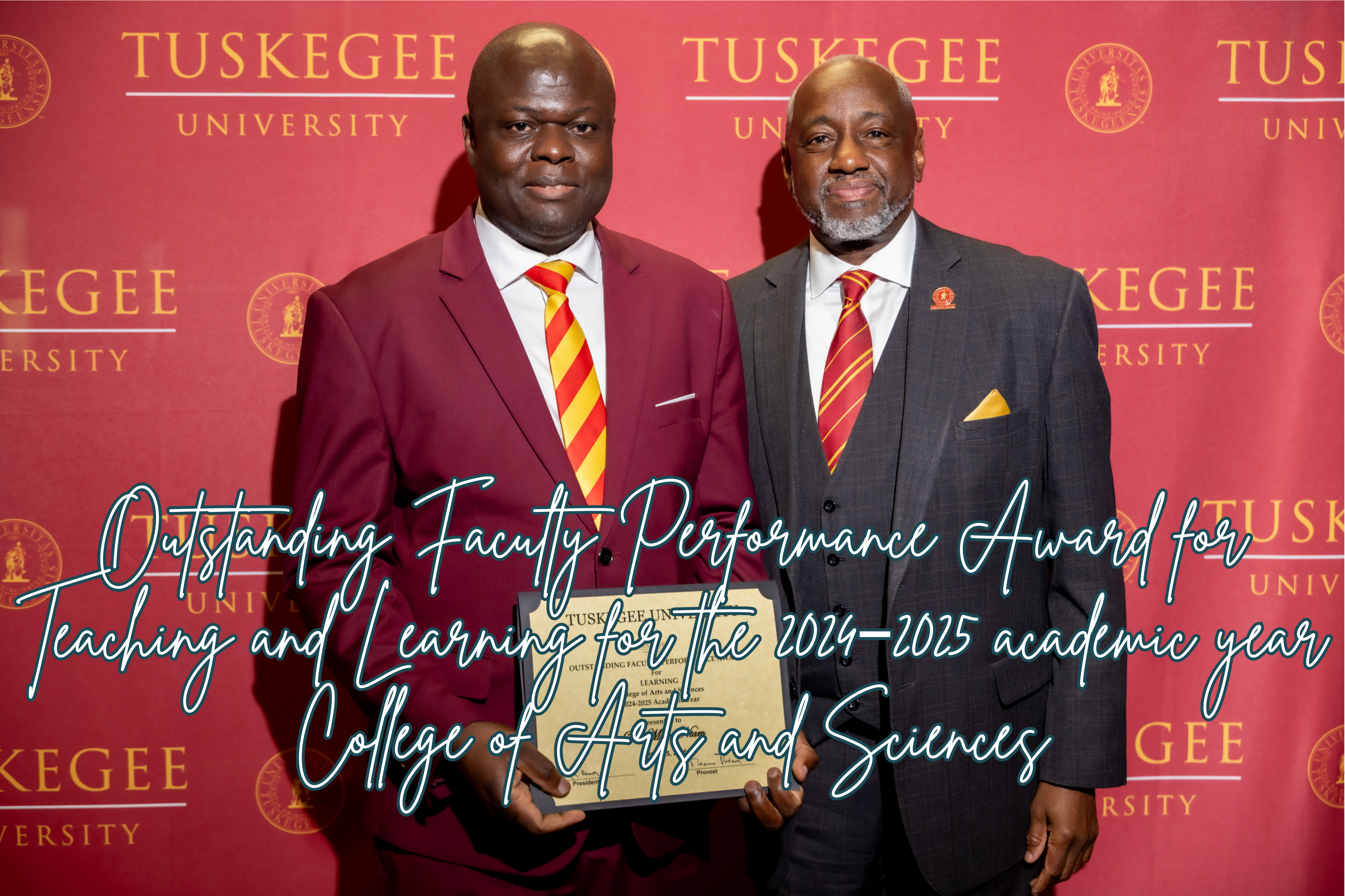 Dr. Moses Ntam receiving Outstanding Faculty Performance Award from University President